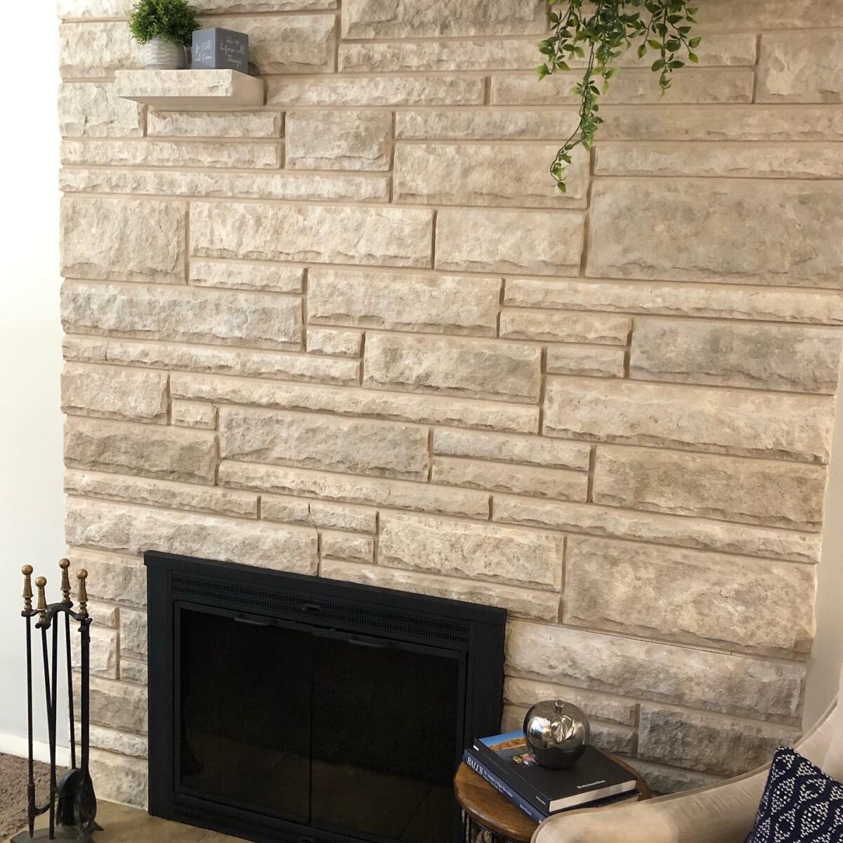 Stone fireplace painted with a natural gray color.