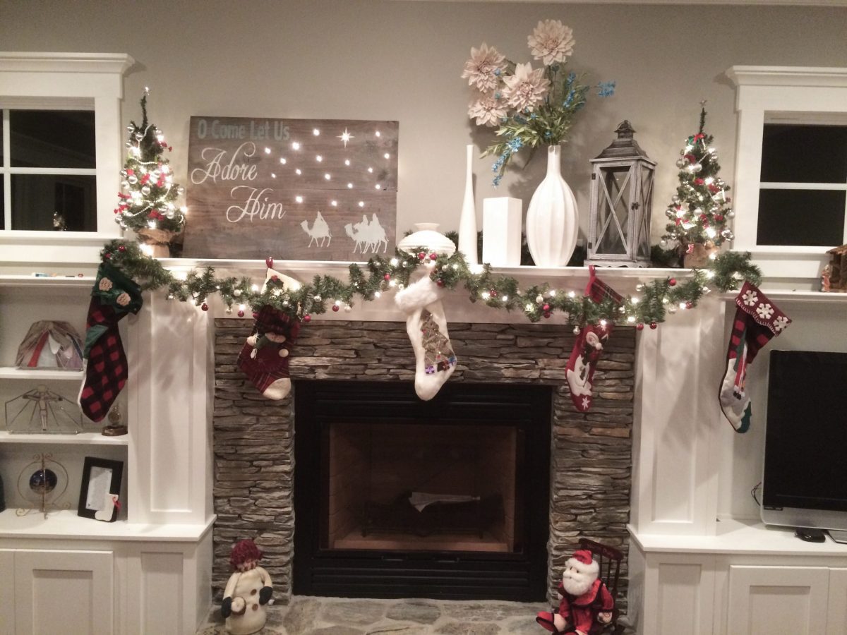 fireplace mantel decorated for Christmas