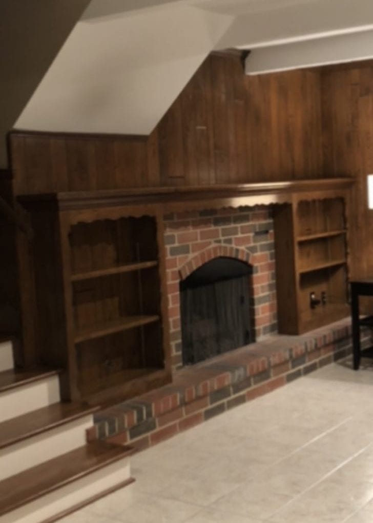 taupe painted brick fireplace        
        <figure class=