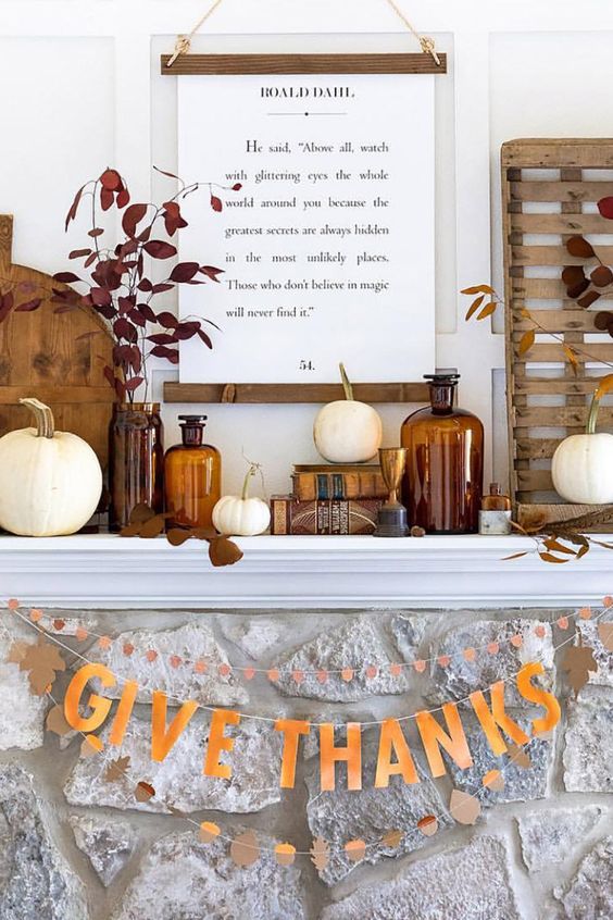 mantel with dark jars, wood, banner, and hanging sign