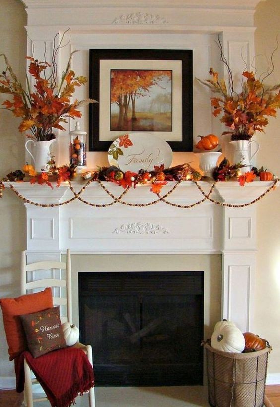 mantel with vases of autumn leaves and twigs, autumn leaf garland, fall painting
