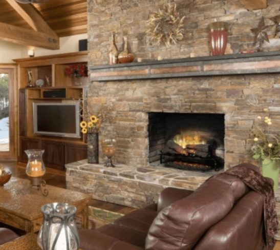 Revillusion 25" oak log set installed into a stone fireplace