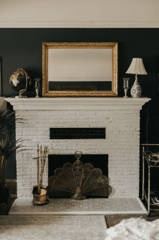 fireplace painted white with decorated mantel