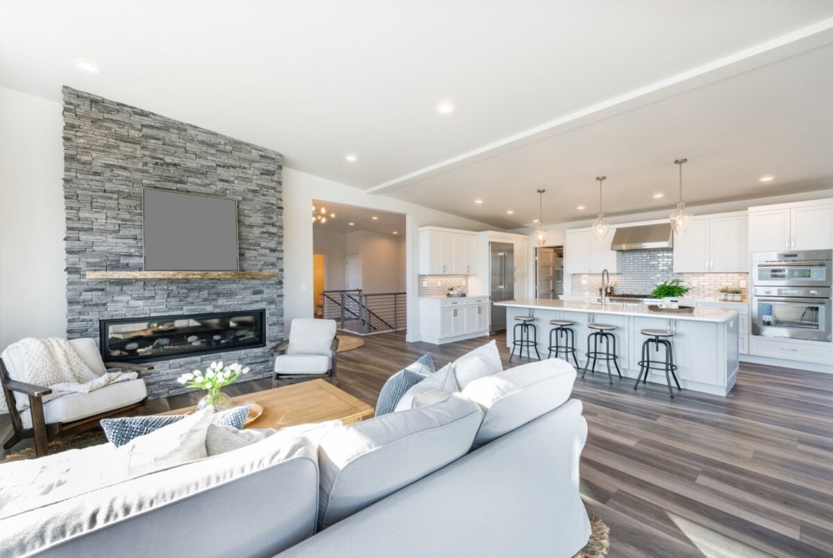 Modern stacked stone fireplace with an electric fireplace inside 