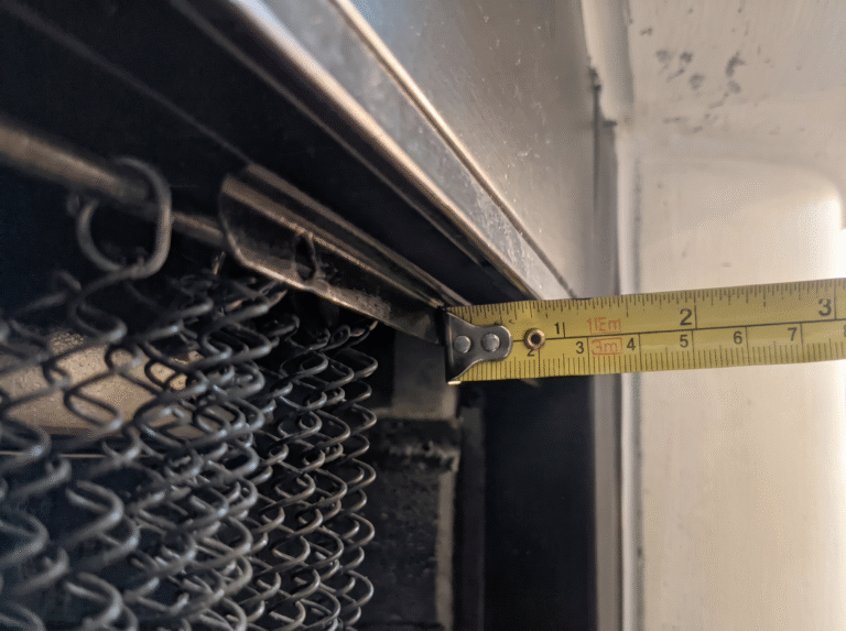 Tape measure showing the recess depth at the top of the opening